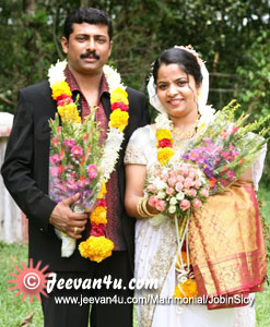 Jobin Sicy wedding photos at St Marys Church Anickadu